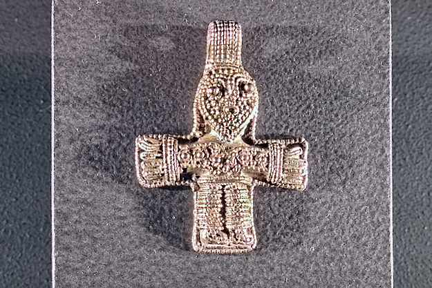 Silver crucifix pendant speaks to a desire for luxurious possessions