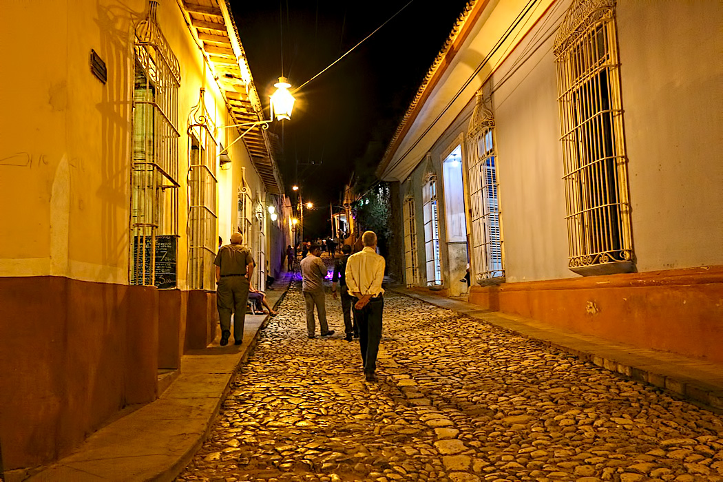 In the evening, golden light washes over the restored colonial homes and cobblestone streets of Trinidad, Cuba