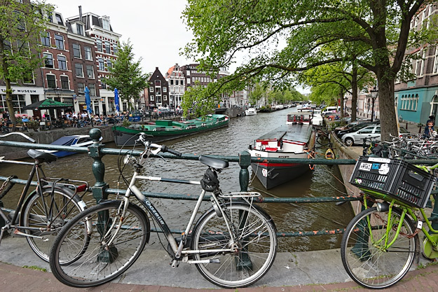 Another canal, another collection of parked bicycles in Amsterdam, Netherlands