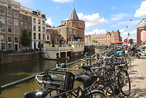 Hundreds, if not thousands of bicycles in Amsterdam are parked at every major city destination