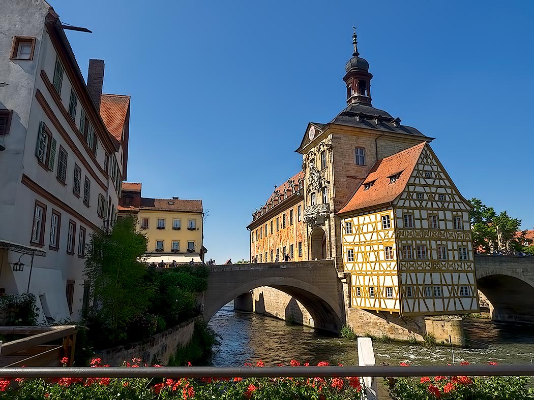 Built in the middle of the Regnitz River, the 14th century Old Town Hall in Bamberg, Germany features a facade decorated with trompe d'oeil frescoes