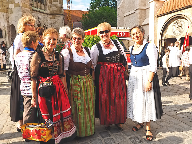 Traditional Bavarian dresses worn by local women during the installation of Auxiliary Bishop Josef Graf in Regensburg, Germany