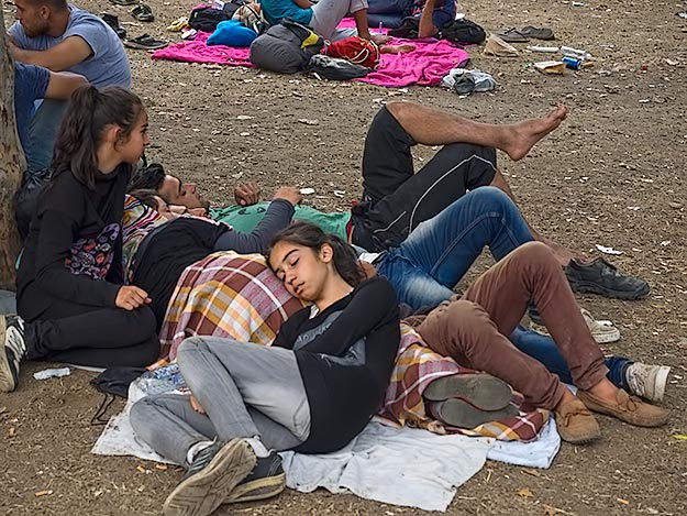 Families huddle together in exhaustion