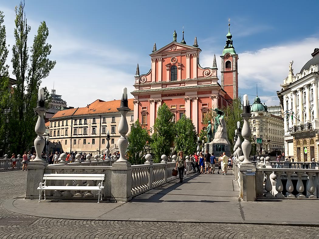 Preseren Square in Ljubljana, the capital city of Slovenia, features the Triple Bridge and the Franciscan Church of the Annunciation