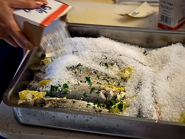 Preparing the salted Sea Bass for baking