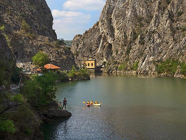 Lake Matka, behind the dam that created the world's first manmade lake. Kayaking is a popular activity in Matka Canyon