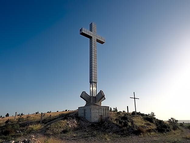 An enormous cross on a mountaintop that overlooks Mostar pays tribute to Christians who were killed during the Bosnian War. The monument is controversial because was built on the former site of a Croatian Bunker, from which bombs rained down on the city, killing countless Bosnian Moslems