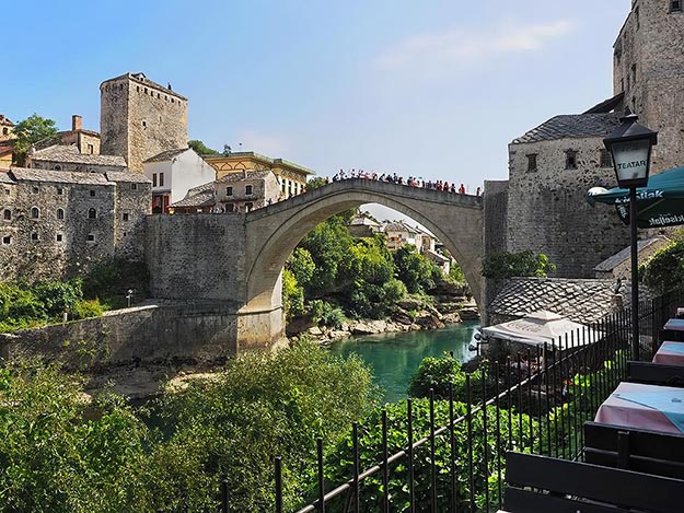 Young men of Mostar have resumed jumping from the restored Stari Most, a long-time right-of-passage that has been converted into a tourist attraction