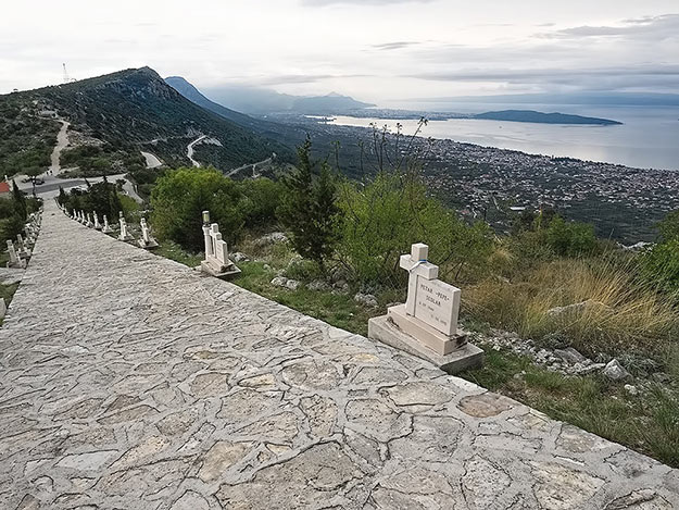 Memorial near Kastel Novi, Croatia honors those who perished in the Balkan War. The long peninsula in the background is the town of Split.