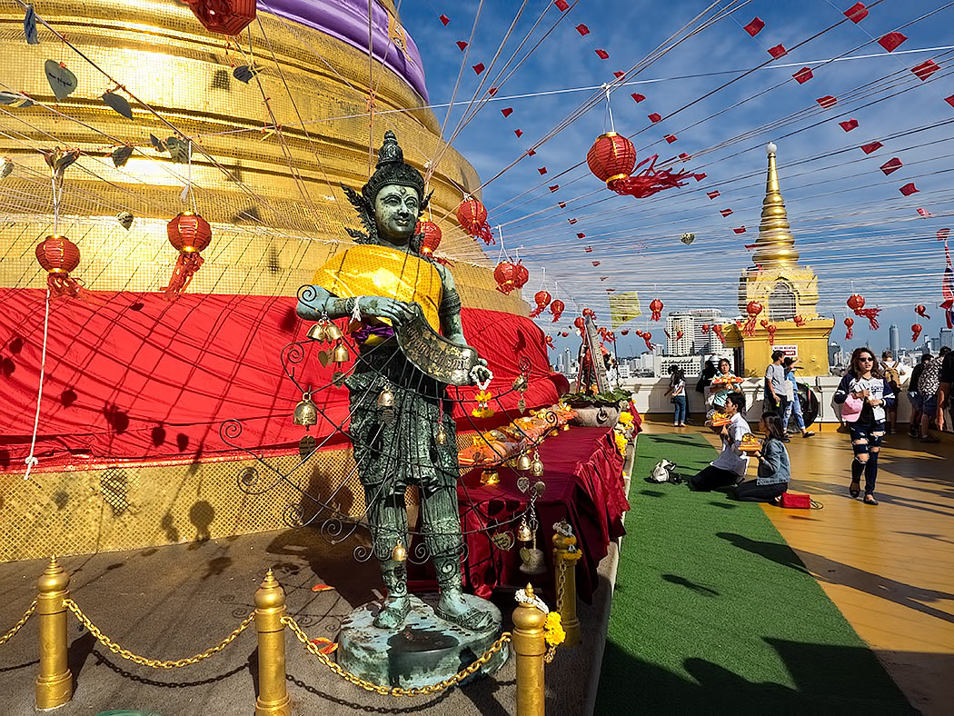Thais make offerings and pray at the Golden Mount in Bangkok, Thailand on New Year's Day