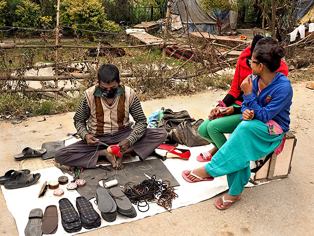 Shoe repairman plies his trade in Kathmandu, as he always has