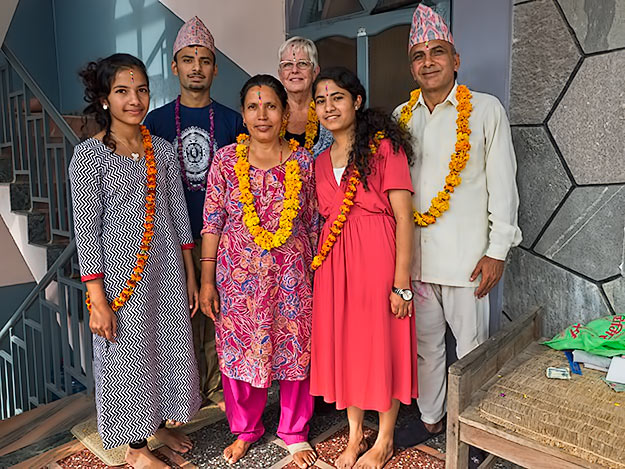 Me with my adopted family on the fifth and final day of Tihar in Nepal, after giving each other rainbow tikas