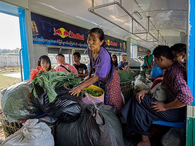 At Danyingon Station, vendors heaped produce into every inch of available space in the aisle