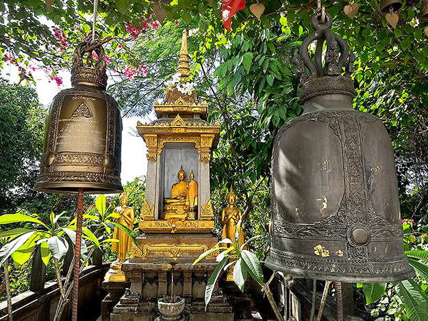Cast bronze bells and shrines line the serpentine stairway to the top of the Golden Mount