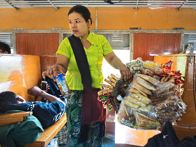 Vendor sells drinks and snacks on the train that crosses the Gok Teik Gorge