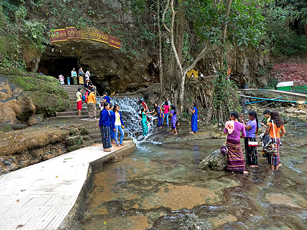 Visitors to the Peik Chin Myaung Cave must wade through the base of a waterfall and negotiate the 45-acre cave complex in bare feet