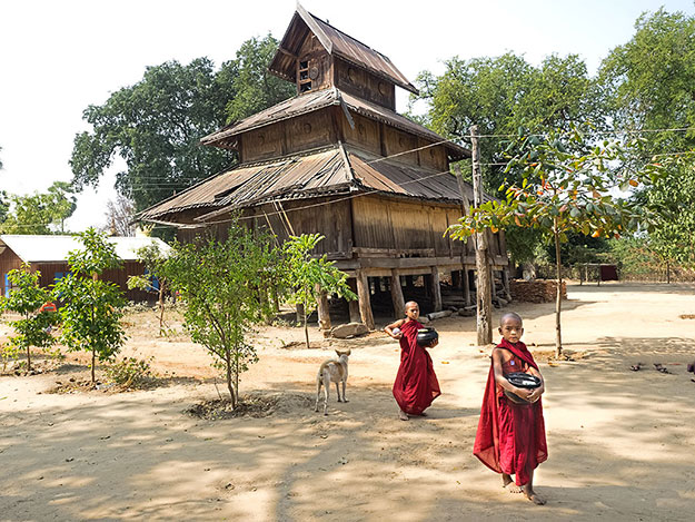 Novice monks in Sale, once home to more than 50 monasteries, like this old teak one that has fallen into disrepair