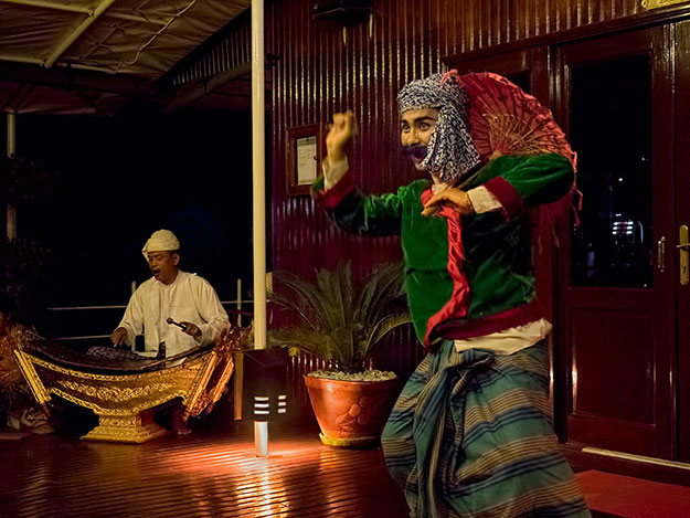 Crew members put on a show during one of our final nights on board the Viking River Myanmar Explorer Cruise, dressing up in traditional costumes and performing traditional dances