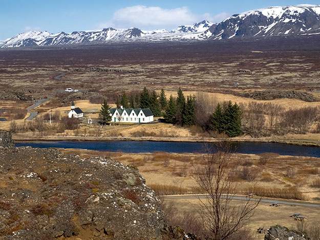 Thingviller National Parkin Iceland sits atop the Mid-Atlantic Ridge that splits Iceland in two. The Eurasian tectonic plate to the east is slowly moving away from the American plate on the west, creating this rift valley that grows every year by at least two centimeters.