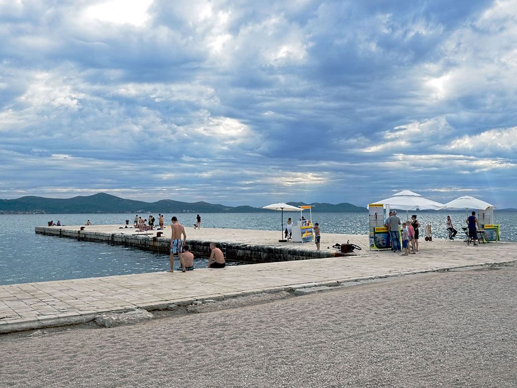Catching some rays on the Riva in Zadar, Croatia