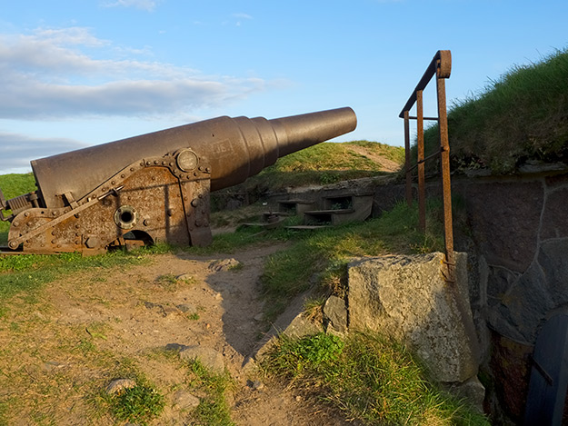 Old cannon sits atop the stone walls of Suomenlinna Fortress