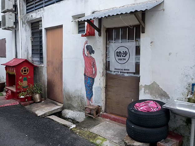 This piece of unnamed street art in George Town blends in so well with its surroundings that it is difficult to find
