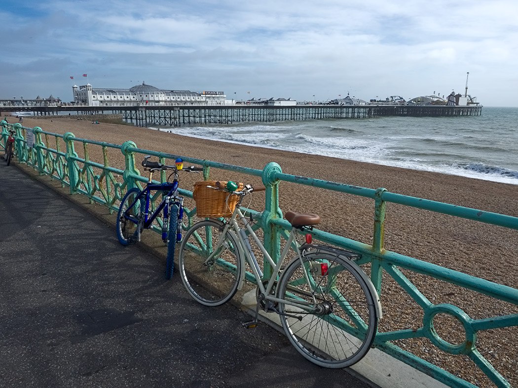 The long strand of Brighton Beach leads to the world famous Brighton Pier in Brighton, England