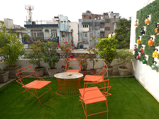 Two individual rooms on the second floor of Prakash Kutir Homestay share this relaxing rooftop terrace