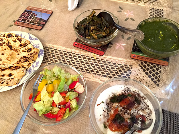 Traditional South Delhi cuisine at Prakash Kutir Homestay included slow cooked ladyfingers, saag paneer, sweet dal dessert with curd sauce and chat spices