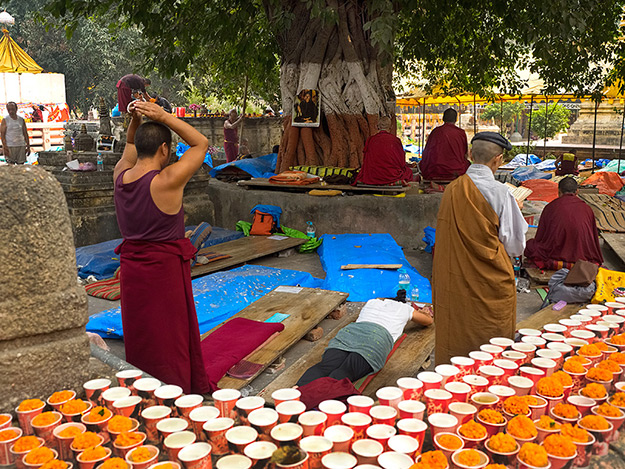 Monks and other pilgrims perform a ritual 100,000 prostrations at Mahabodhi Temple