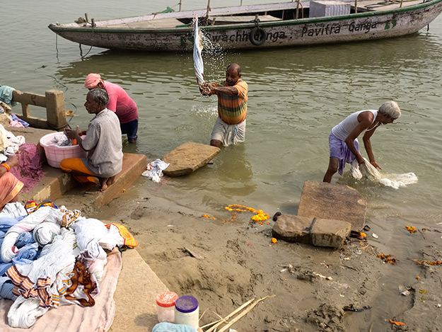 Locals wash their laundry in the Ganges River