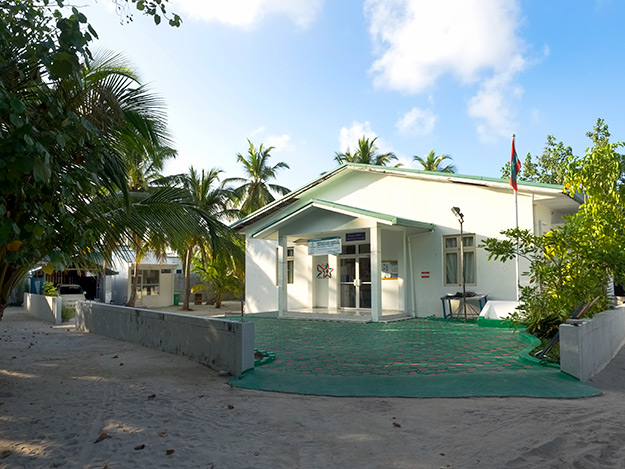 Health clinic, pharmacy, and an ambulance, the only car on the island of Bodufolhudhoo