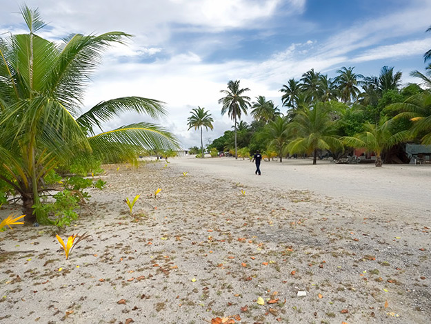 Main road leads to the harbor on Bodufolhudhoo Island in the Maldives