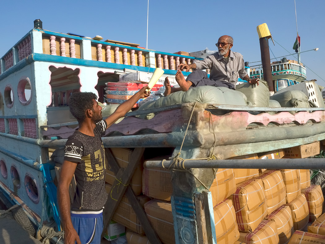 Old wooden cargo boat on Dubai Creek in Dubai, UAE, is loaded down and ready to haul anchor