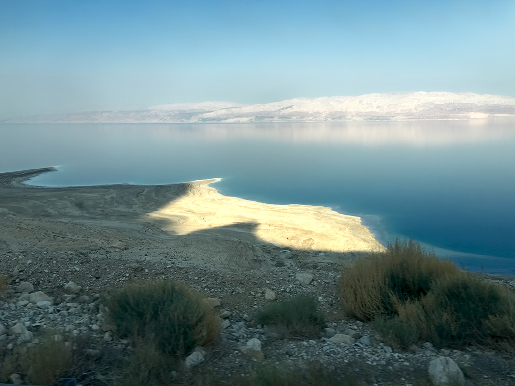Sunset over the Dead Sea in Israel. Swimming in areas other than designated beaches is very dangerous, as the shoreline is littered with sinkholes that can open up unexpectedly and swallow everything.