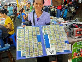 In addition to fresh fruits and vegetables, visitors can purchase Thai lottery tickets at the fresh market at Chiang Mai Gate in Chiang Mai, Thailand