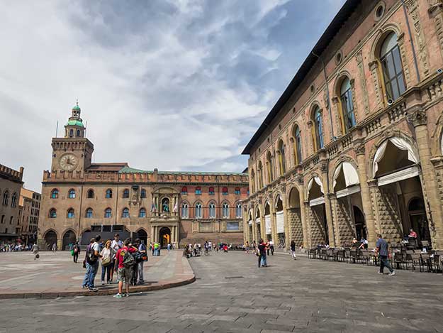 The Palazzo D'Accursio (left) on Piazza Maggiore, serves as the Town Hall and Palazzo del Podesta (right) is home to sidewalk cafes where people watching is the main activity