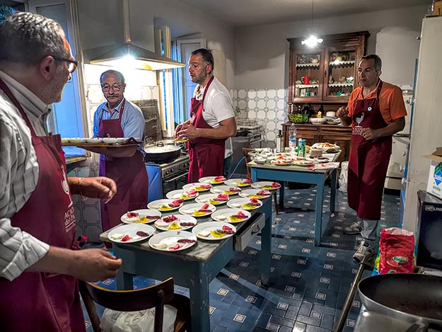 Members of the Academia del Padlot prepare dinner for us on our final evening at Palazzo Donati, a true authentic Italian experience