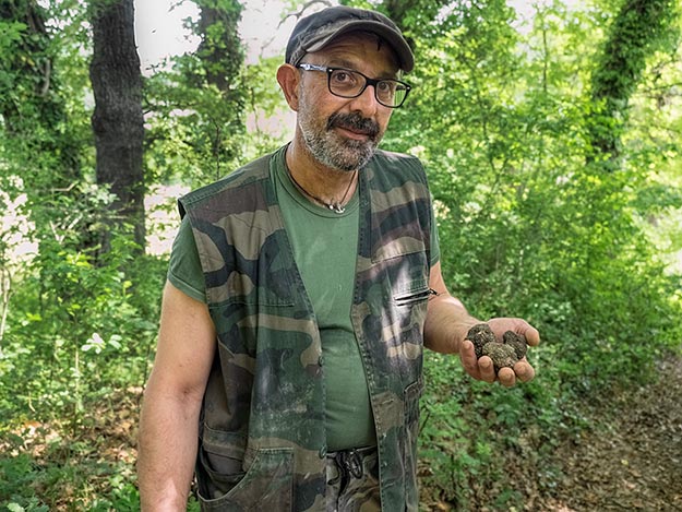 Umberto Sacchi offered a different kind of Italian experience when he offered to take us n a truffle hunt. Here he displays truffles dug up by his exceptionally well-trained truffle-hunting dog, Nina