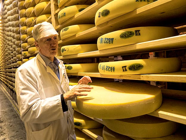 Bertrand Henrio, owner of Fort des Rousses Affineur, shows us wheels of Comte being aged deep in the bowels of the old fortress