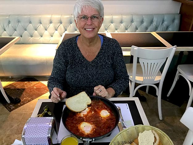 Barbara Weibel enjoying the traditional Israeli dish known as Shakshuka in Jerusalem, March 2017