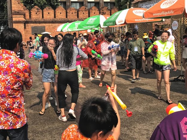 Thailand-Chiang-Mai-Songkran-water-fights People celebrate Songkran in Chiang Mai, Thailand, by soaking one another with water guns, water canons, or even by pouring buckets of water over one another