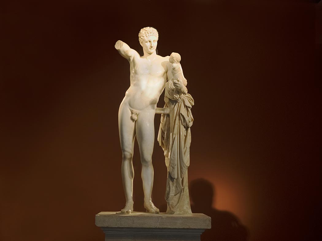 Hermes and the Infant Dionysus, generally attributed to the sculptor Praxiteles, is the preeminent exhibit at the Archeological Museum in Olympia Greece