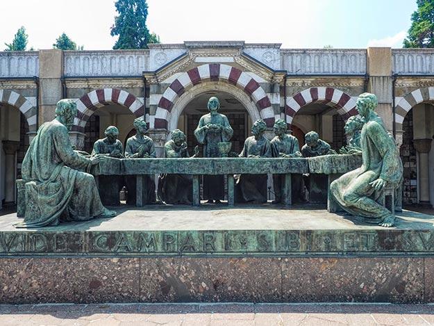 Bronze sculpture of the Last Supper by Giannino Castiglioni sits in front of the Campari family tomb in Monumental Cemetery in Milan, Italy