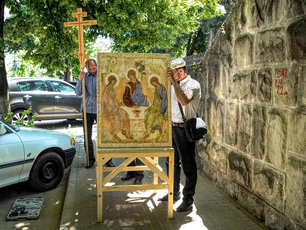 Pilgrims carry a religious icon through the streets of Chisinau, Moldova