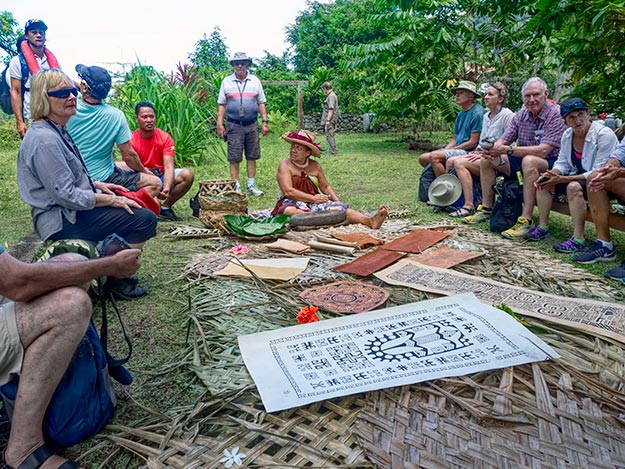 Mama Sara demonstrates the process of making Tapas parchment paper on Fatu Hiva island in the Marquesan Archipelago