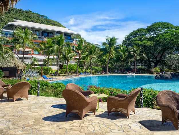 The perfect place to read a book, sip a cocktail, or just do nothing at all - poolside at Tahiti Pearl Beach Resort