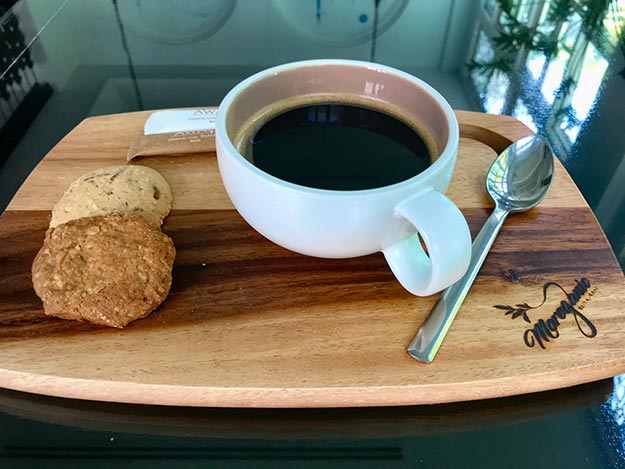 The Americano coffee at Away Vegetarian Resort comes with two fresh-baked cookies
