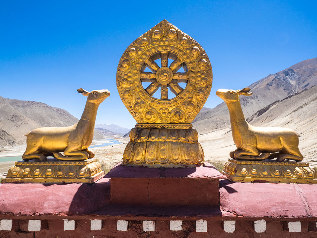 Auspicious Buddhist Symbols on the Roof of Phuntsoling Monastery in Tibet