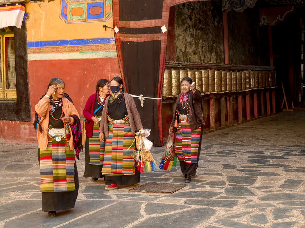 Women in traditional Tibetan clothing at Sakya Monastery in Tibet